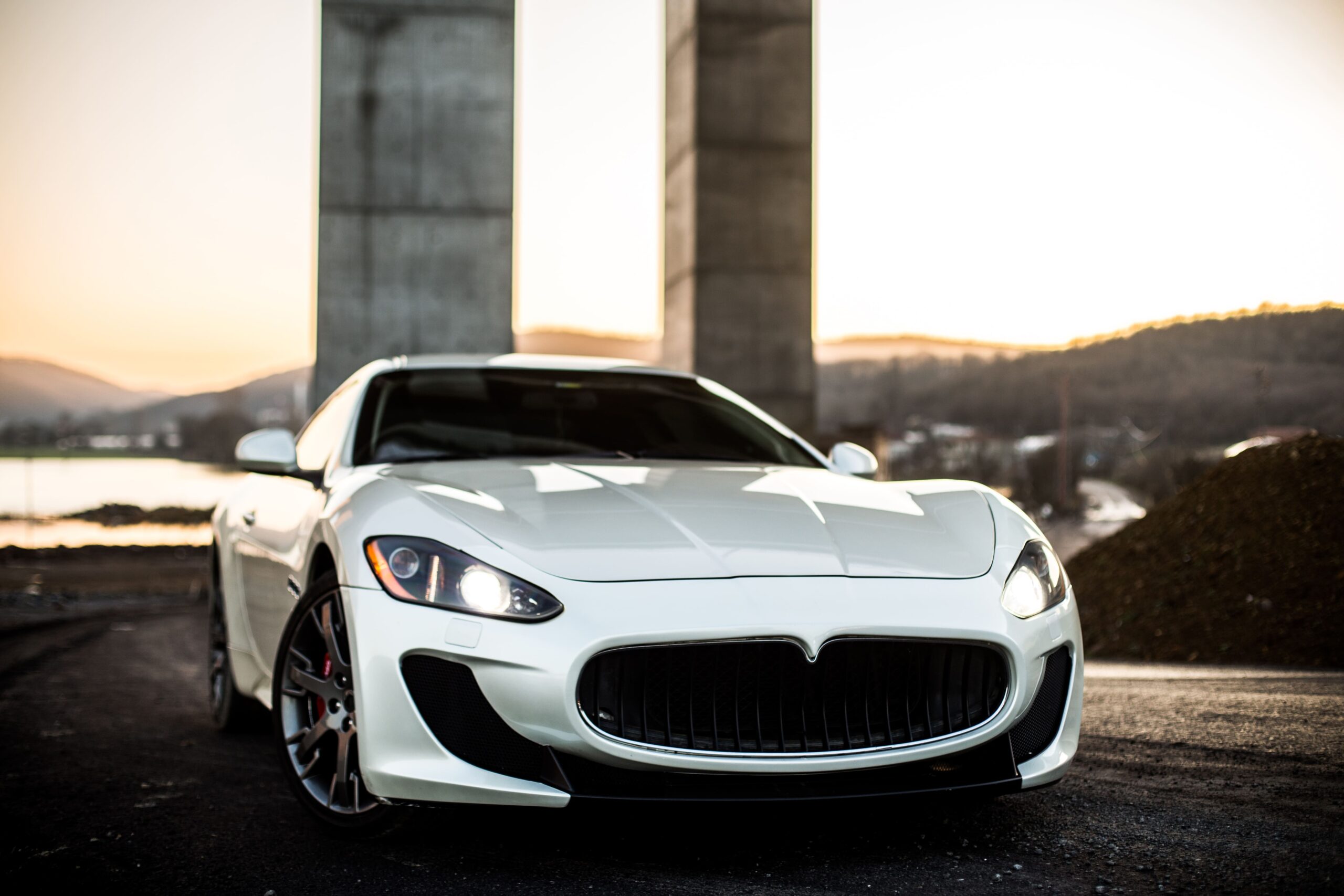 white-coupe-sport-car-standing-road-front-view